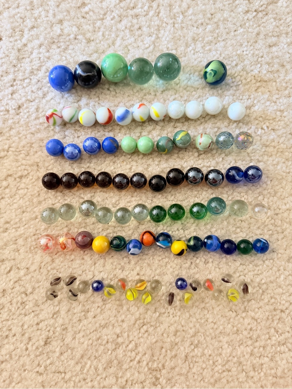 Collection of vintage glass marbles, various colors and size